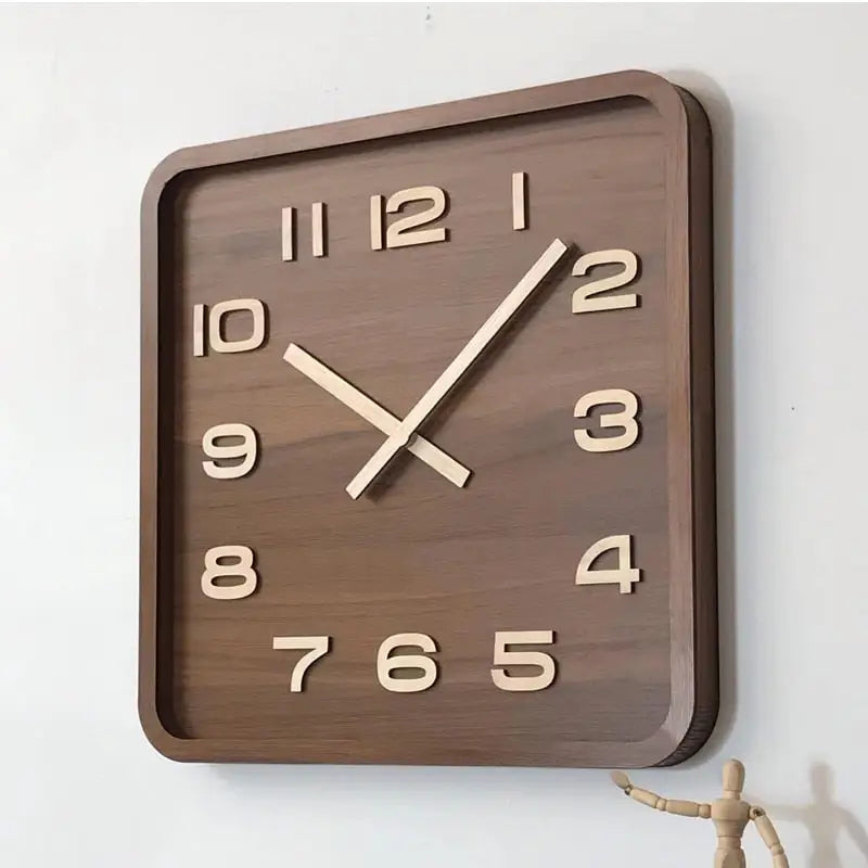 Close-up of analog hands on a square wood wall clock