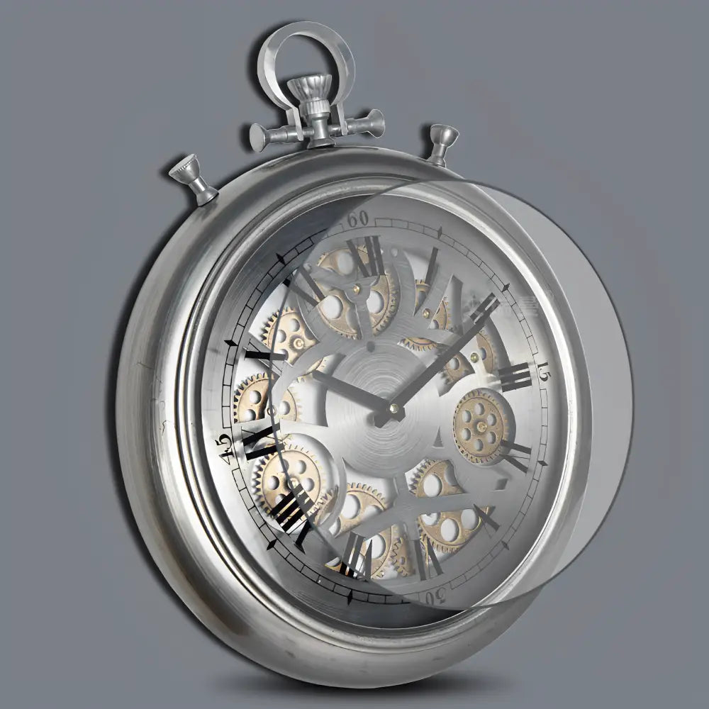 Close-up of rotating gear motif and glass mirror face on industrial wall clock