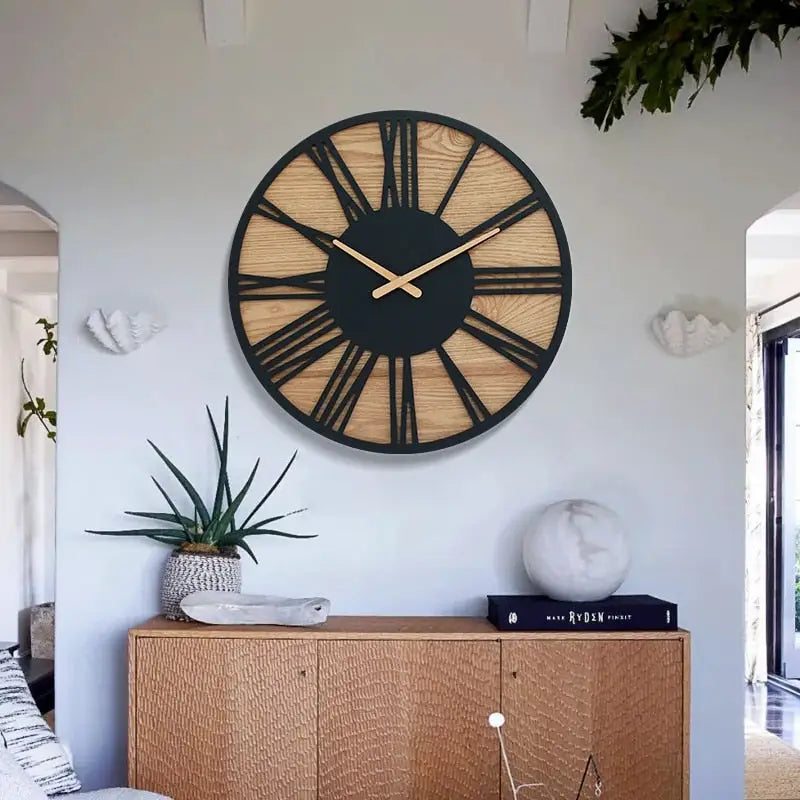 Wood and black metal wall clock hanging above a living room sofa
